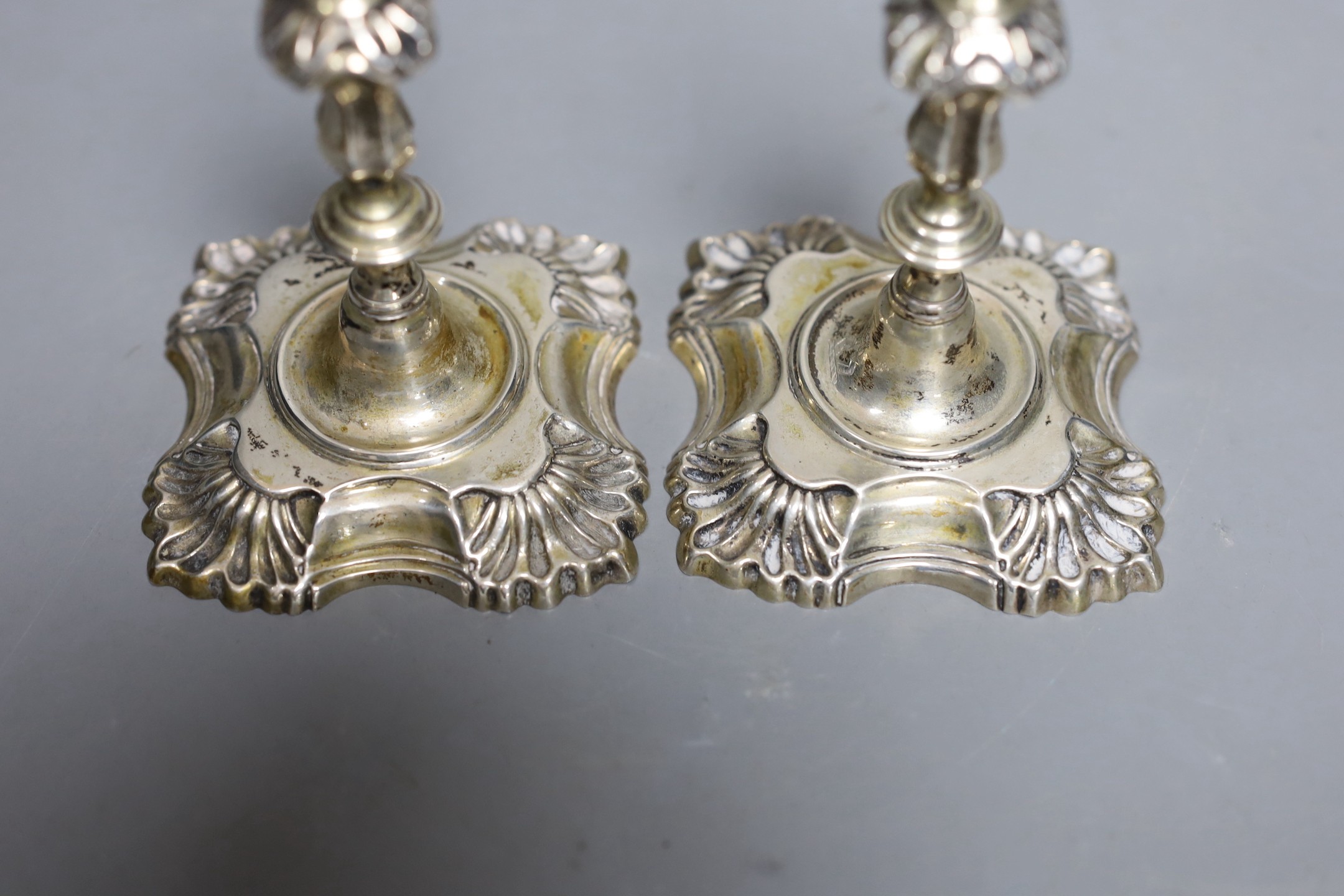 A pair of George V silver taper sticks, by Garrard & Co Ltd, London, 1934, 12.1cm, 10.7oz.